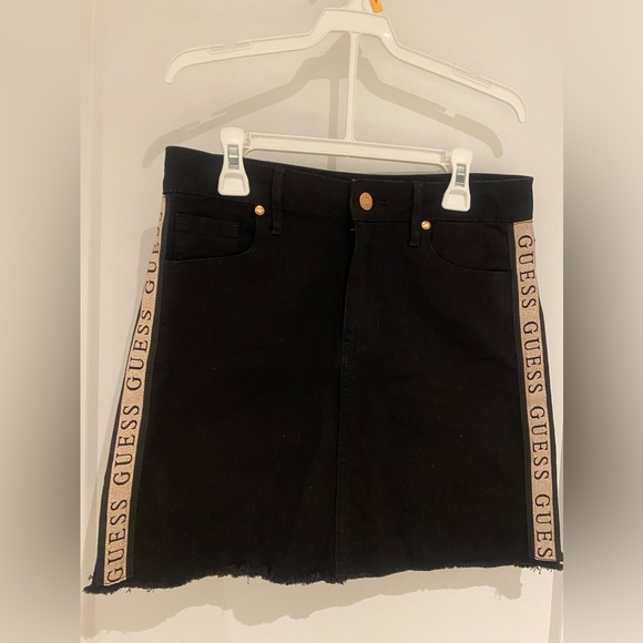 Black mini skirt with metallic gold ribbons on sides. - Picture 1 of 3